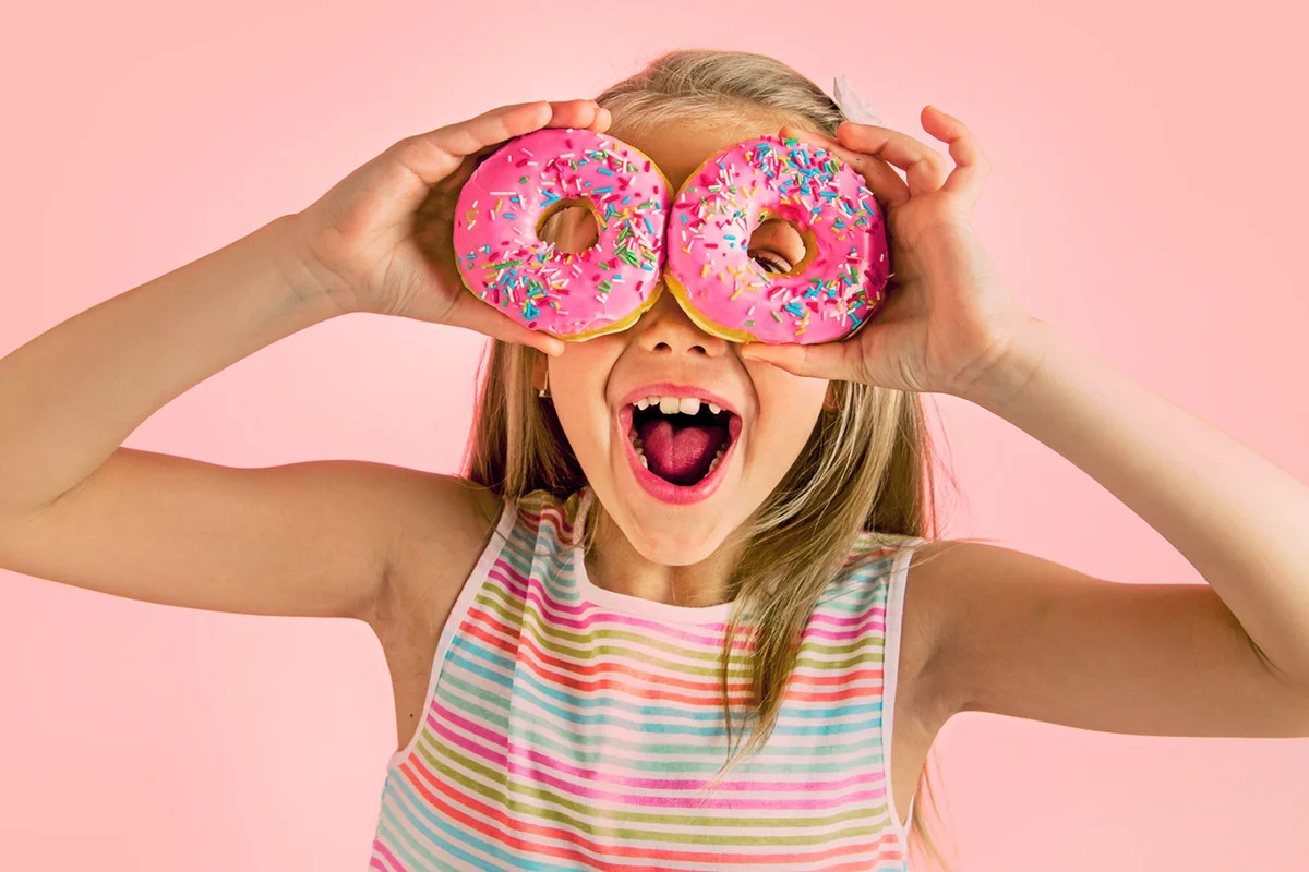 girl with pink donuts for theme party