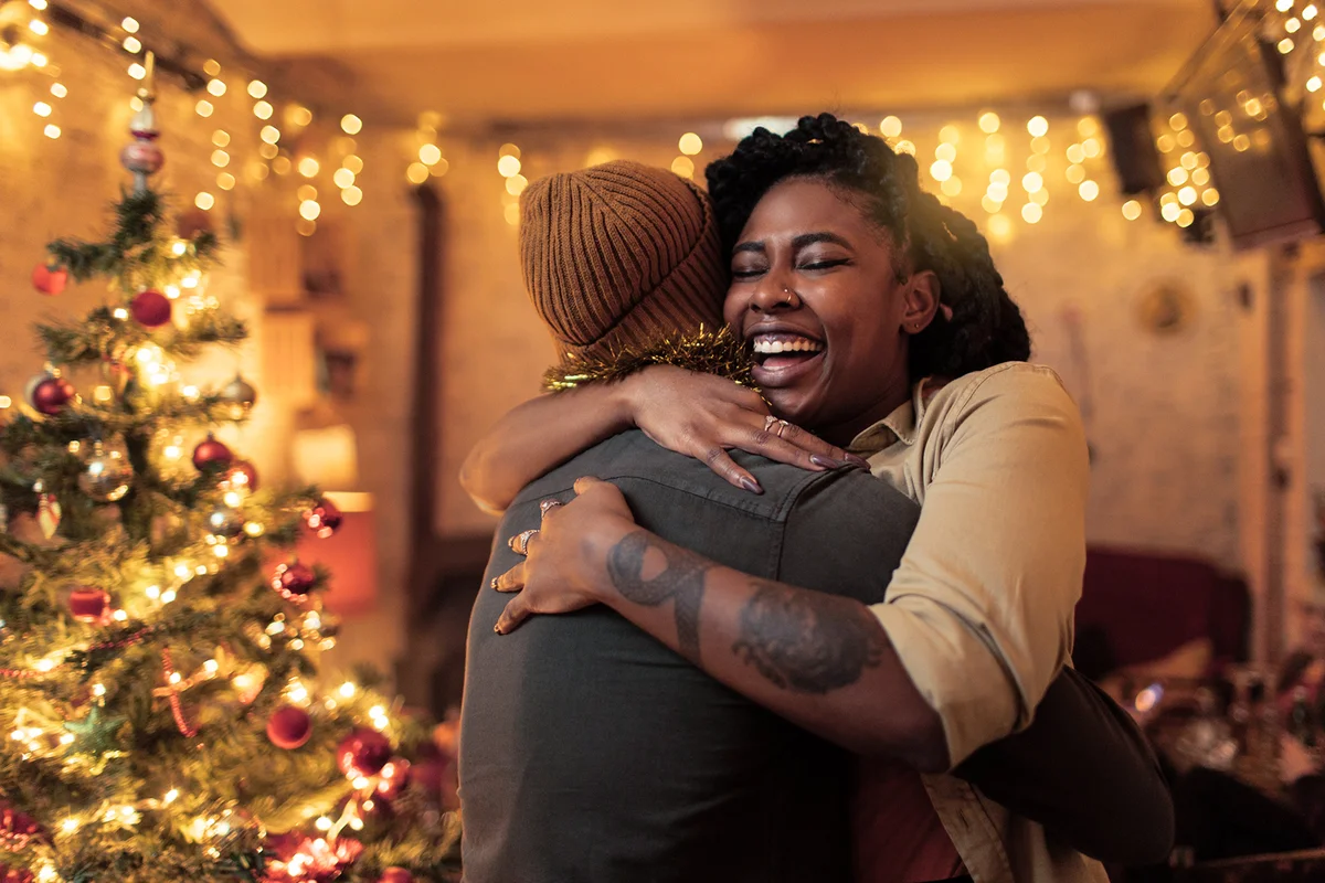 Couple hugging on Christmas eve