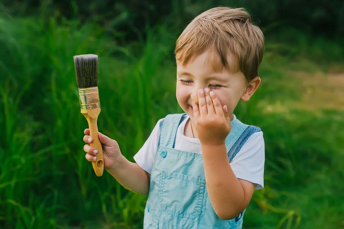 boy with paint brush
