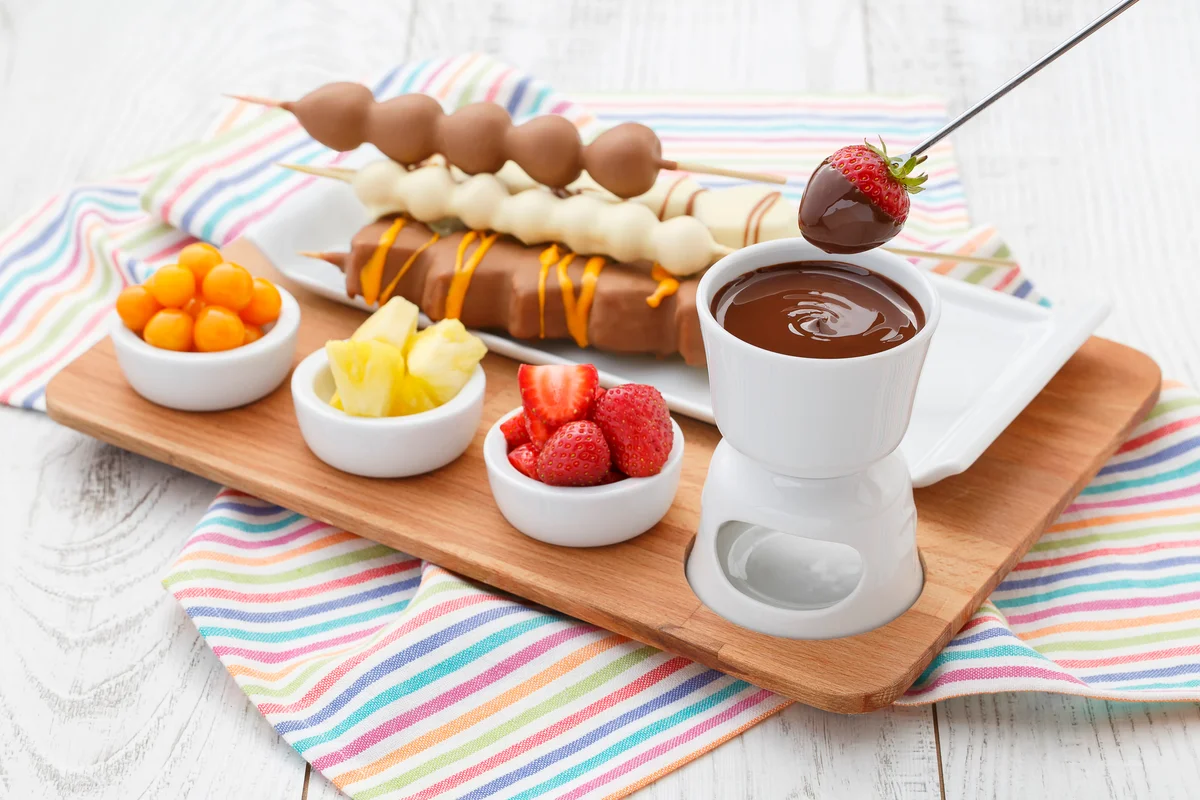 chocolate fondue platter with strawberries pineapple