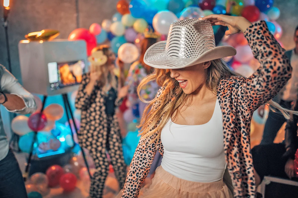 Woman with cowboy hat at new year's eve party