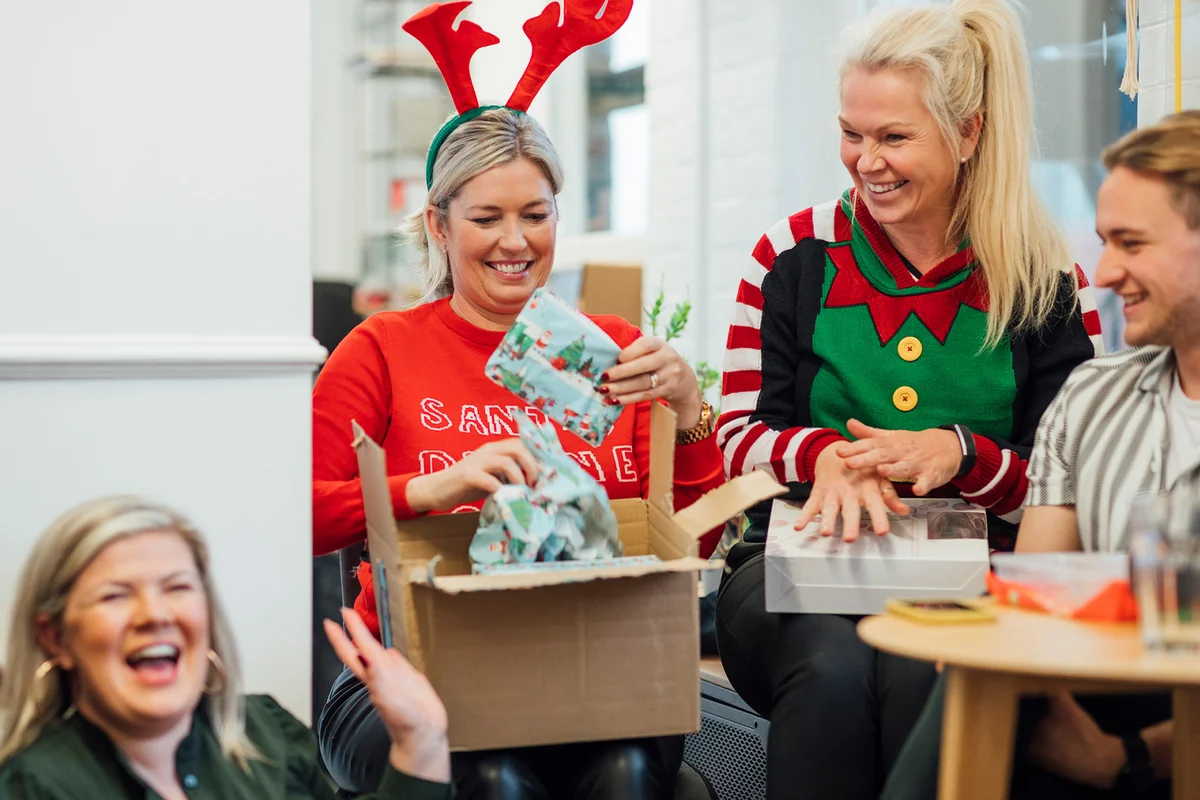 unwrapping gifts as part of secret Santa