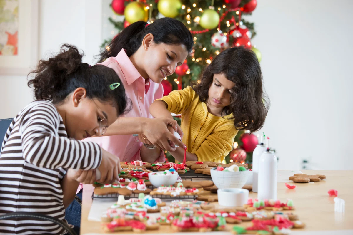family decorating Christmas cookies