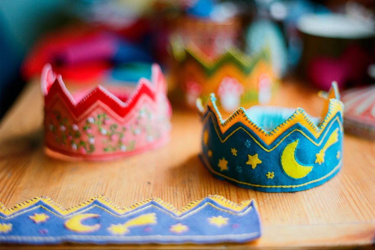 felt crowns on table for prince and princess