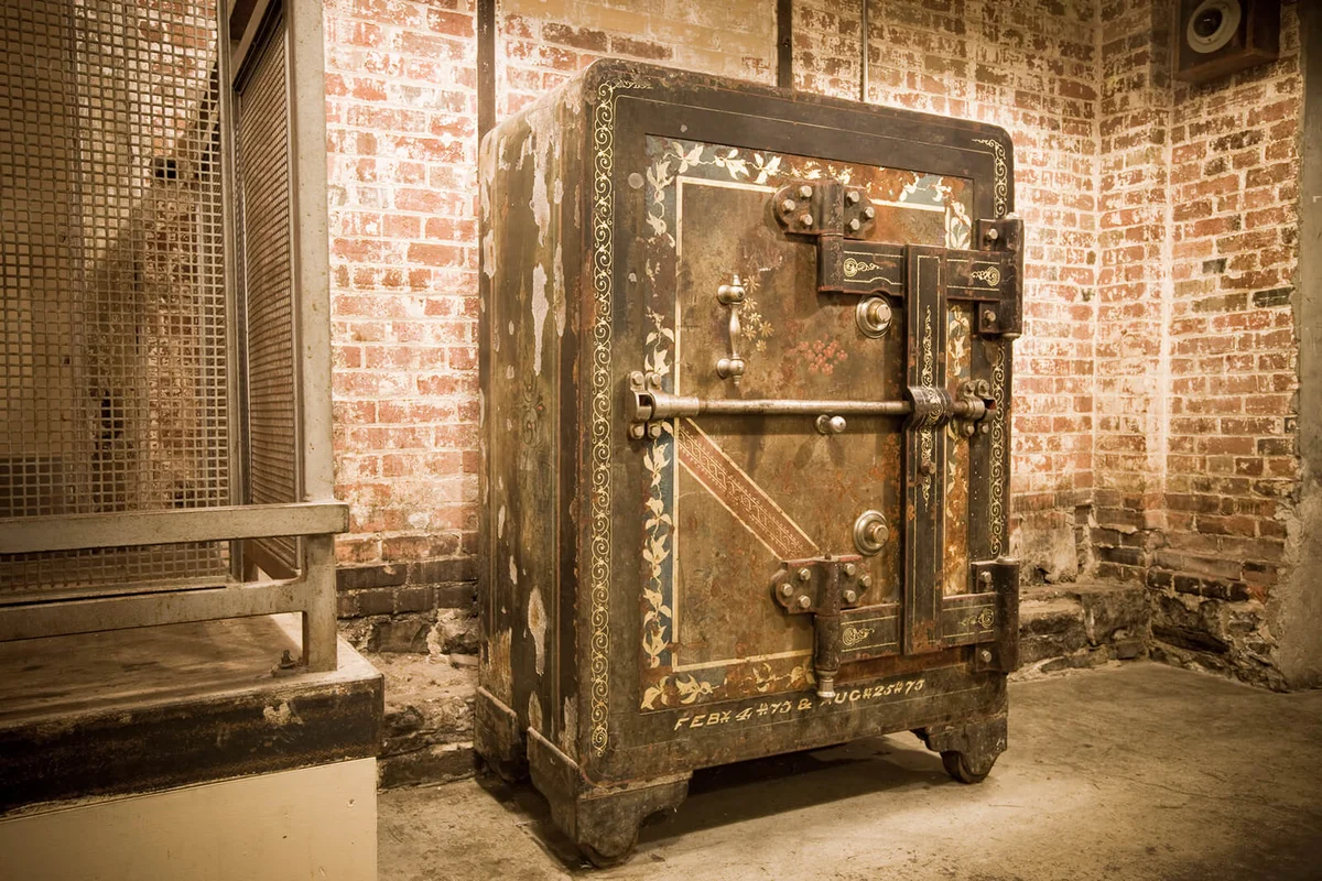 An antique safe at a grungy place
