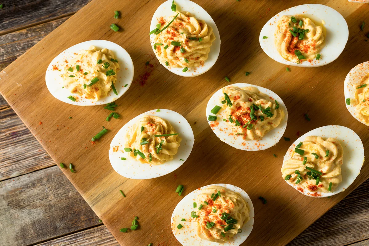 festive deviled eggs with chive topping