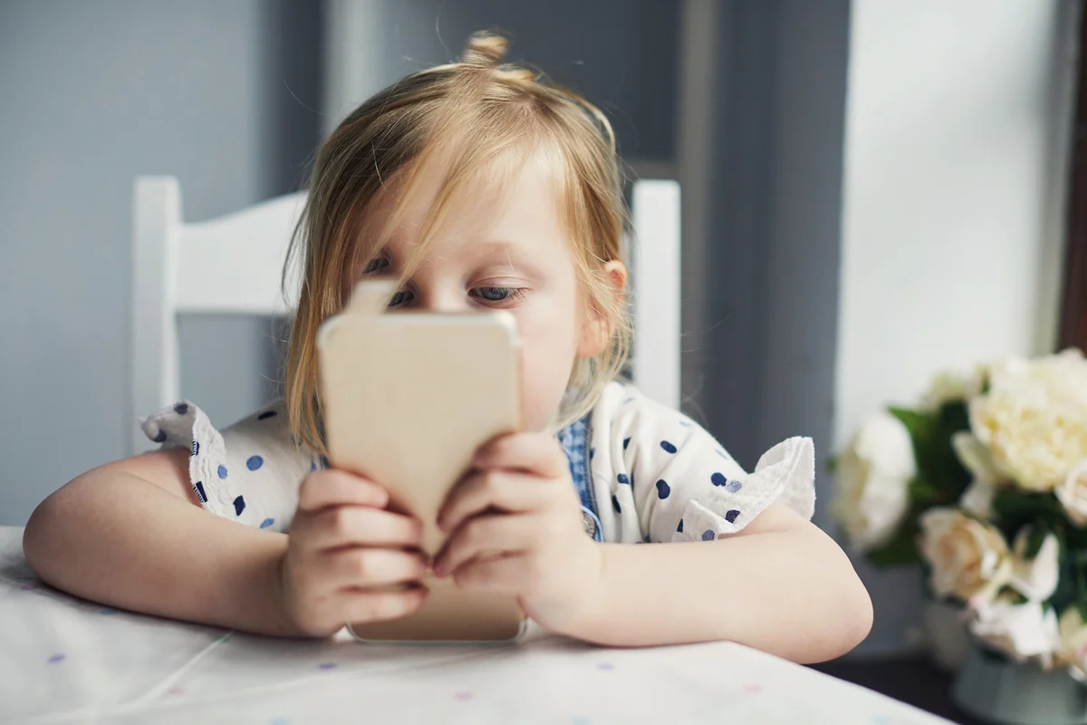 Toddler girl using a smartphone