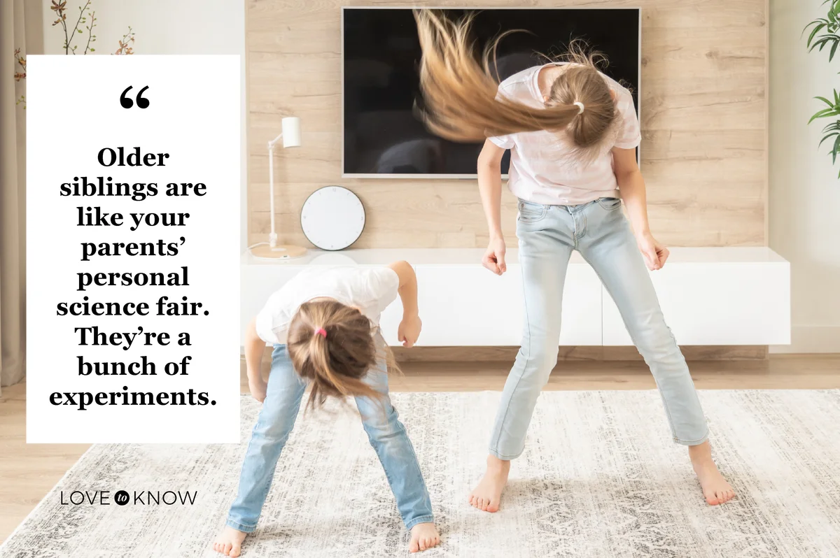 Two sisters having fun dancing in living room