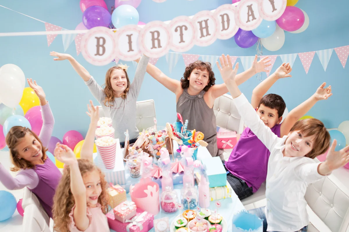 Children cheering at birthday party