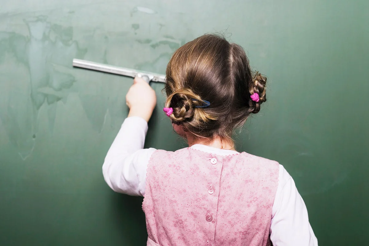 Using a Squeegee To Clean Chalkboard