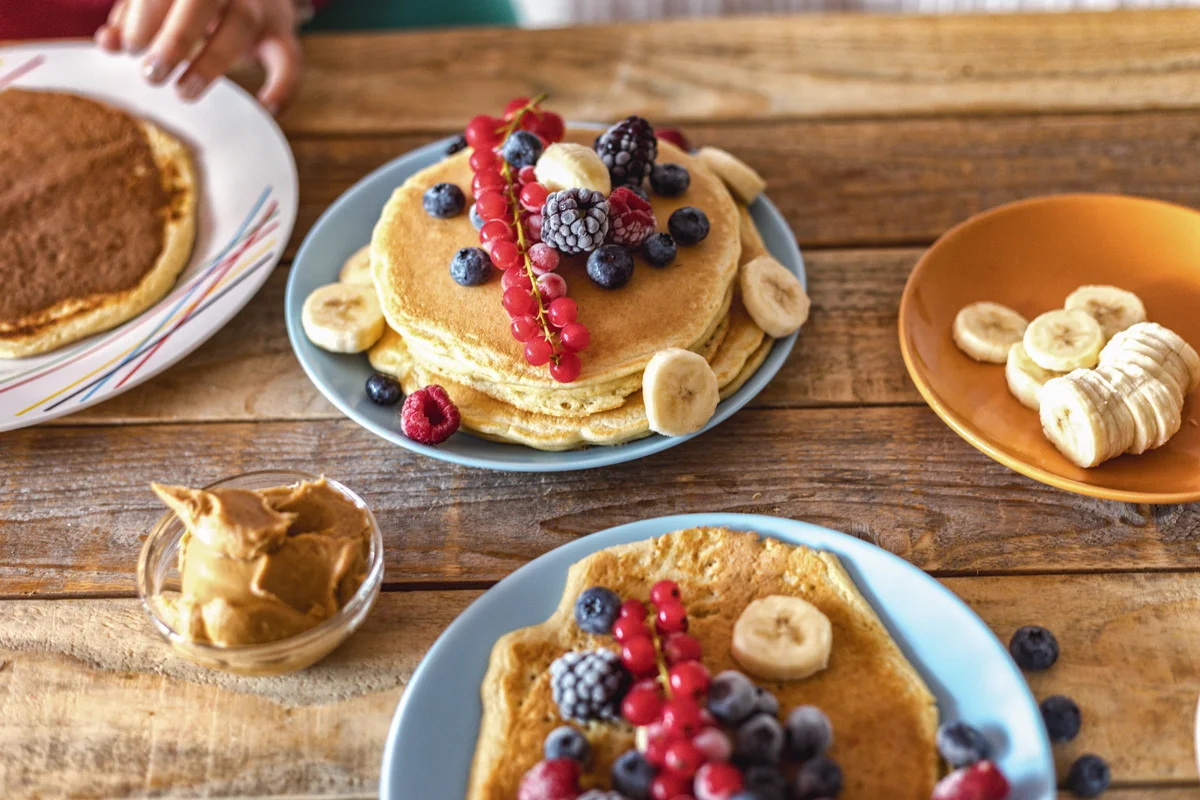pancake buffet with fruit and peanut butter