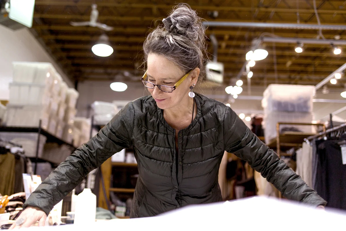 Woman pattern cutting in studio