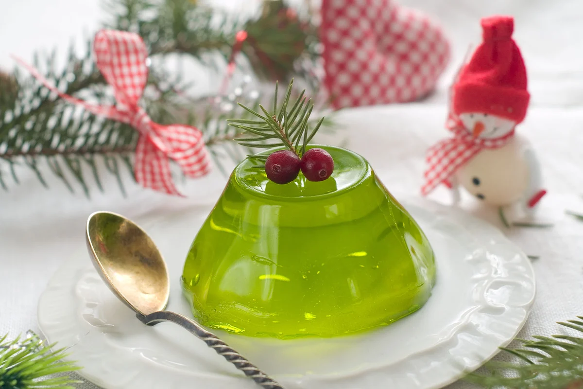 Peppermint Jell-O Shots on a plate with christmas decoration