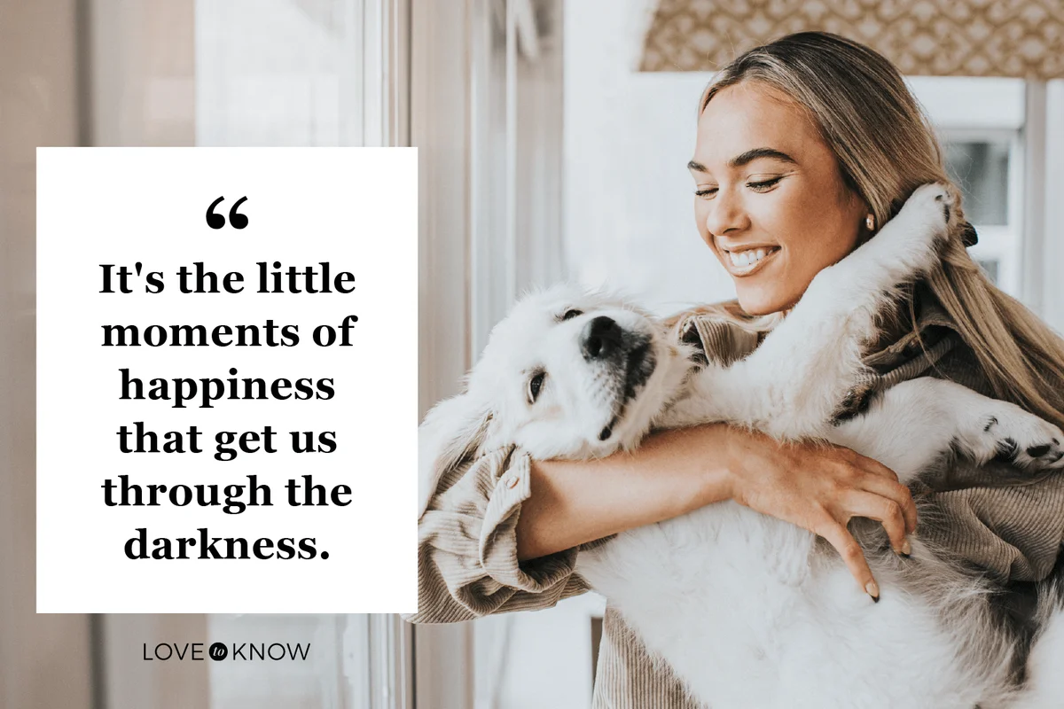 Woman cuddles her 12 week old Golden Retriever Puppy