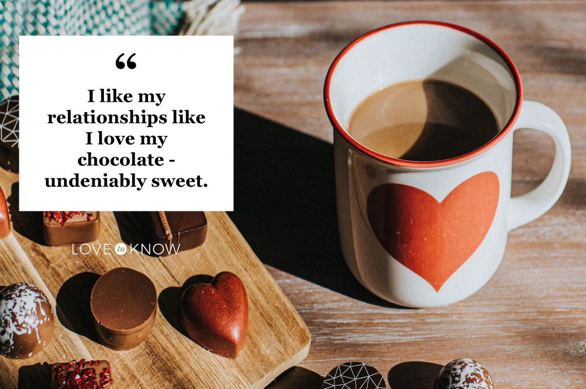 Luxury chocolates on wooden surfaces beside a cup of hot chocolate