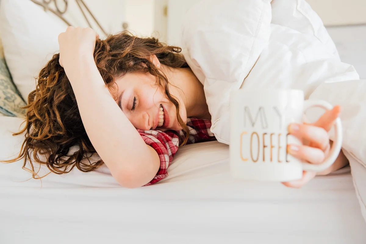 Sleepy Woman holding coffee mug