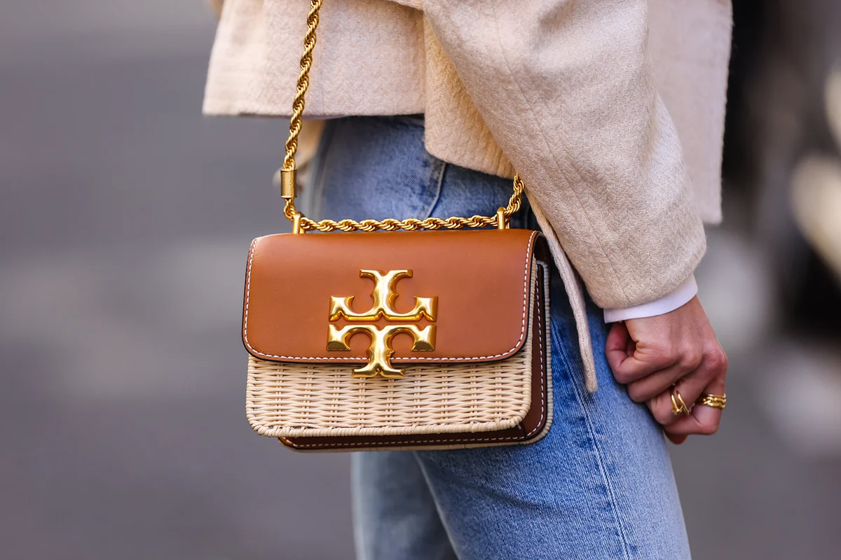Beige wicker and brown shiny leather Tory Burch handbag - Getty Editorial Use