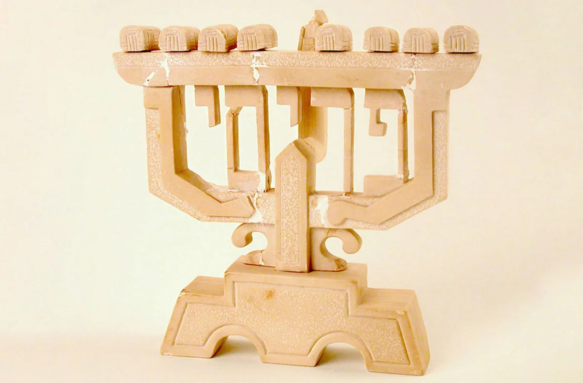 Hanukkah menorah carved from limestone