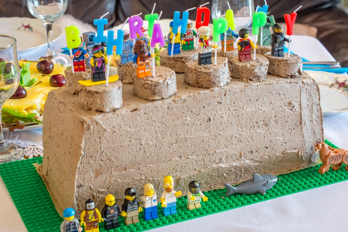 Home made chocolate birthday cake with lego toys