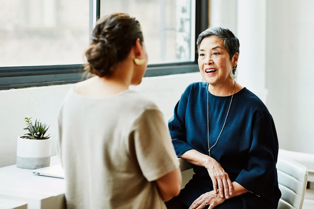 two women having a respectful conversation at work