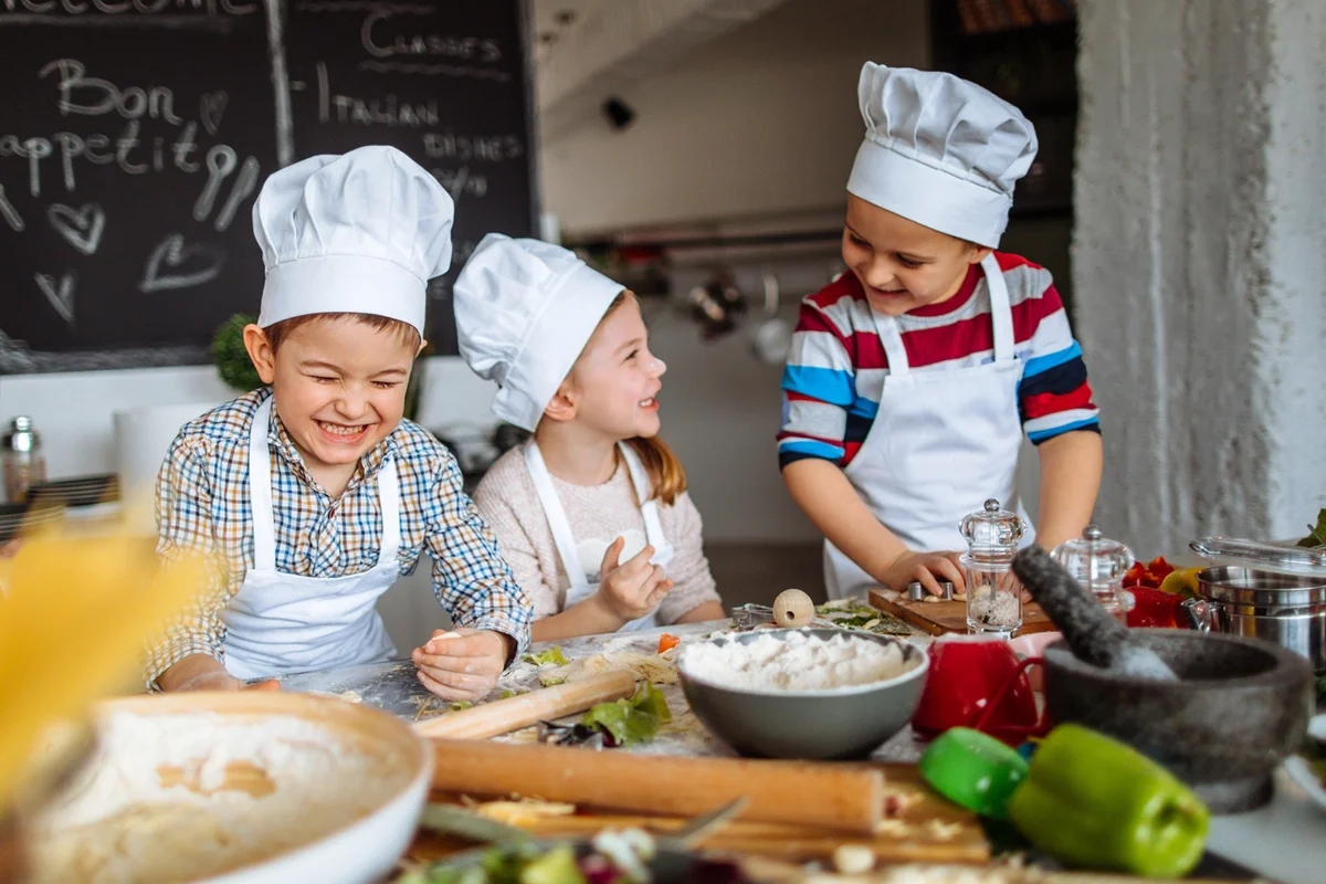 Group of children having fun during cooking class