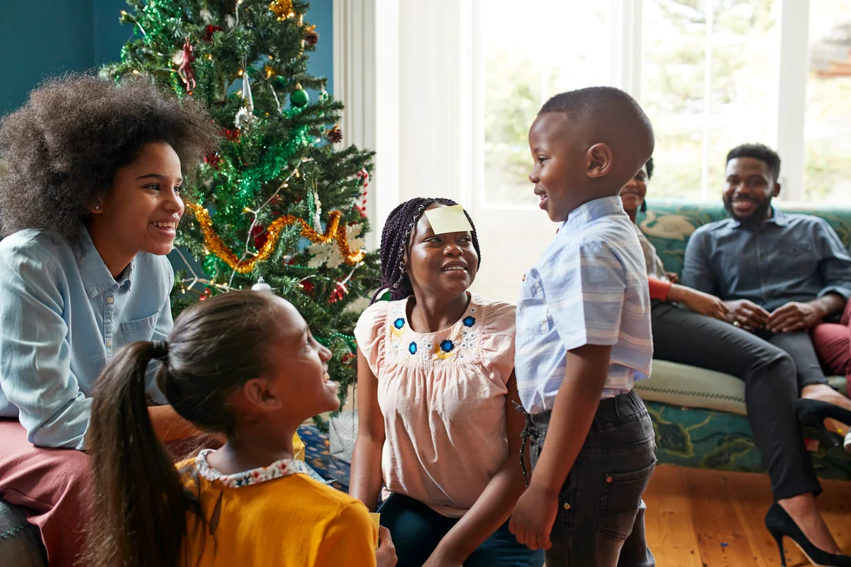 Family playing a game over Christmas