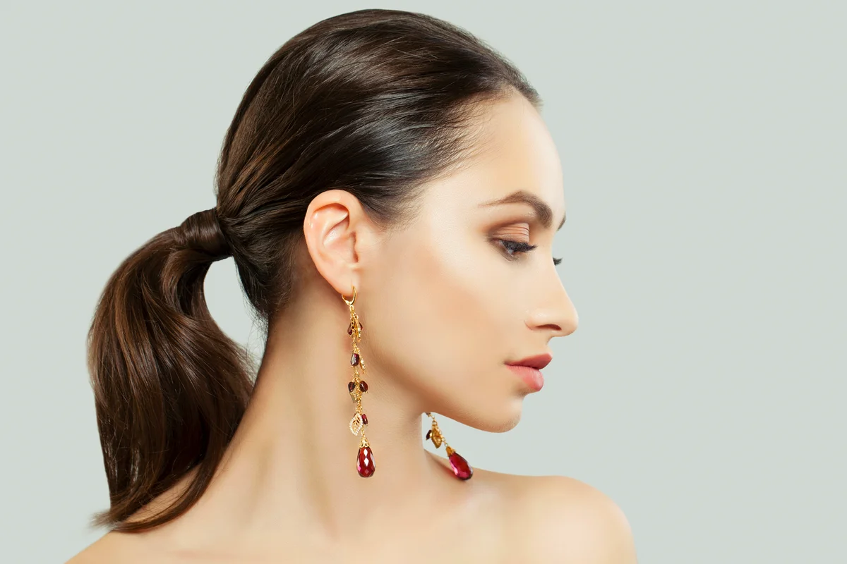 Woman wearing garnet pendents