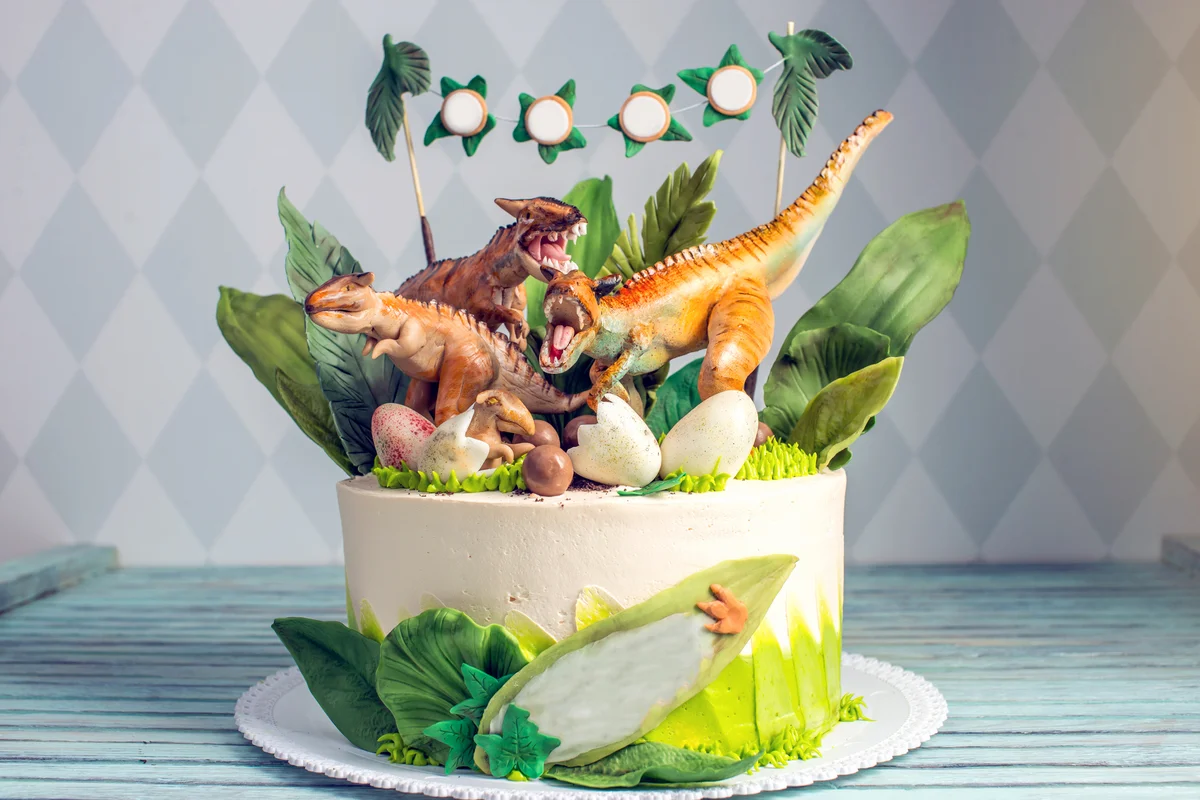 Naked cake decorated with dinosaurs