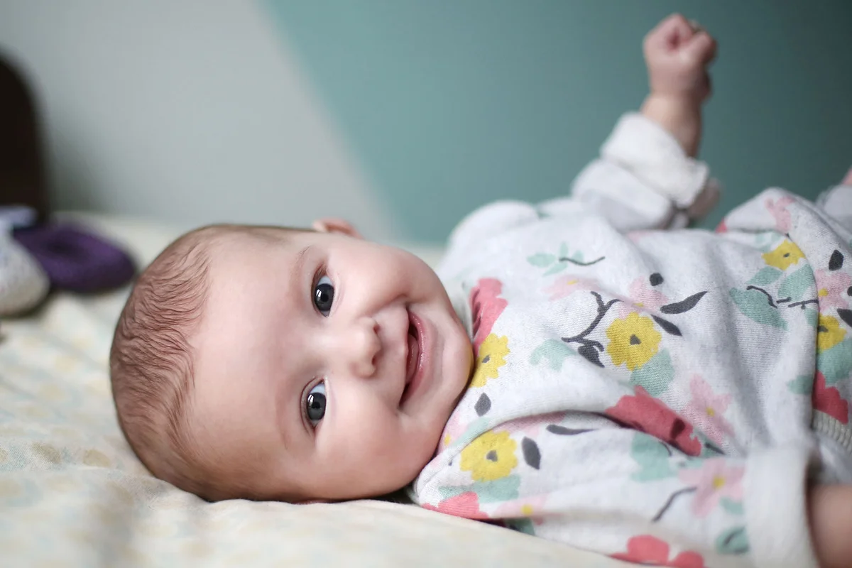 infant girl wearing flower pattern outfit
