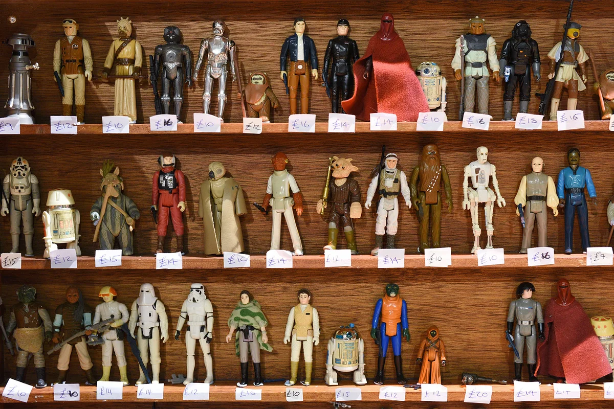 Star Wars action figures displayed on shelf | Getty Editorial Use
