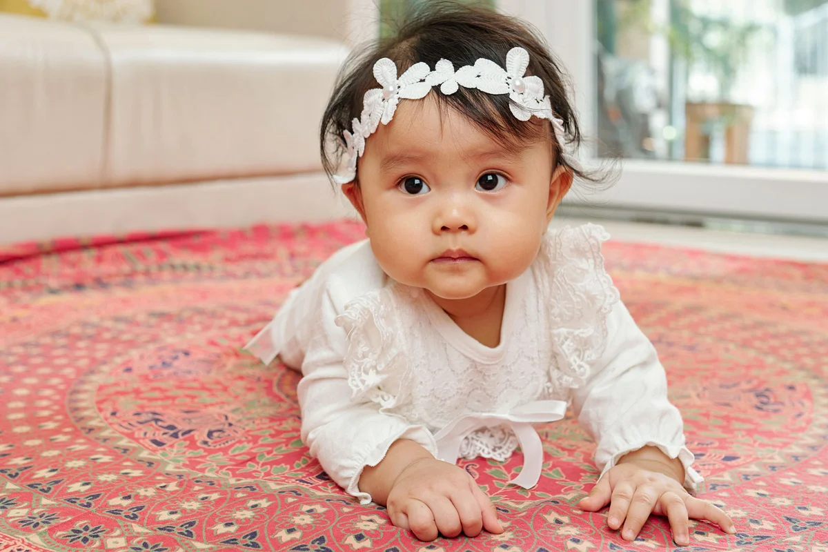 baby girl with white flower headband