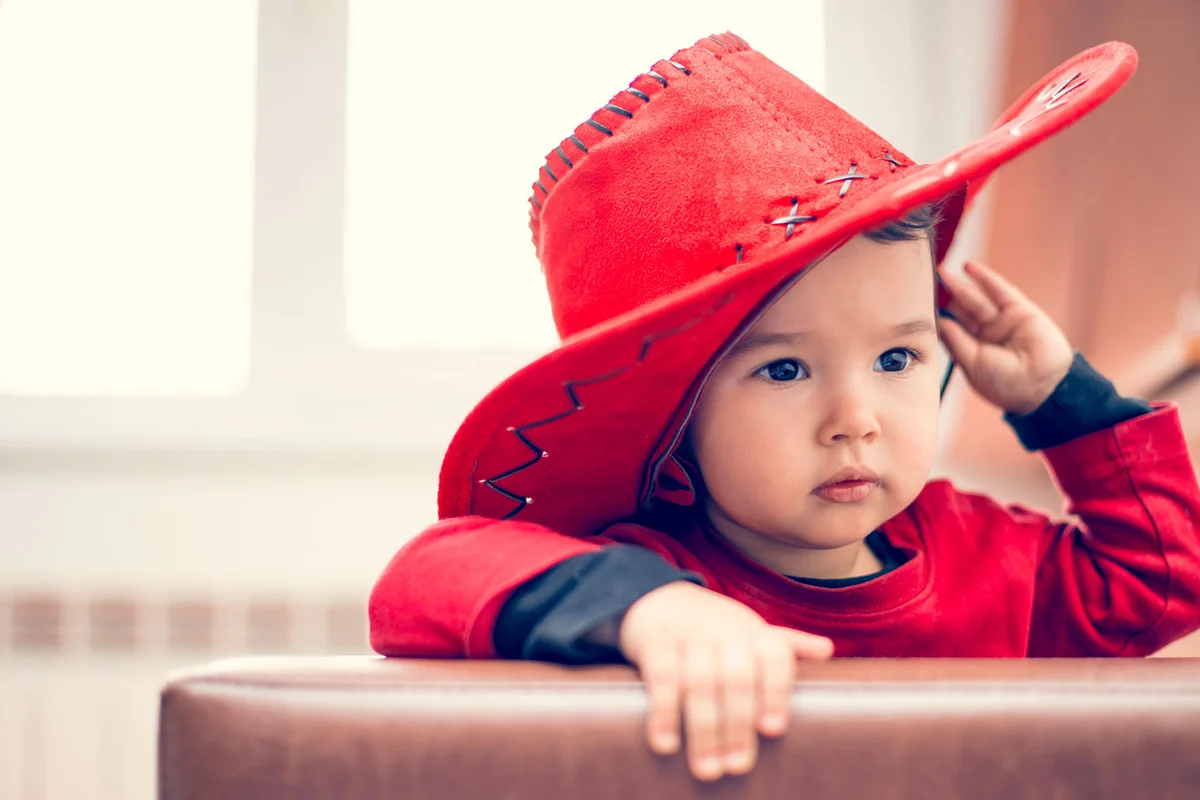 baby girl wearing a cowboy hat