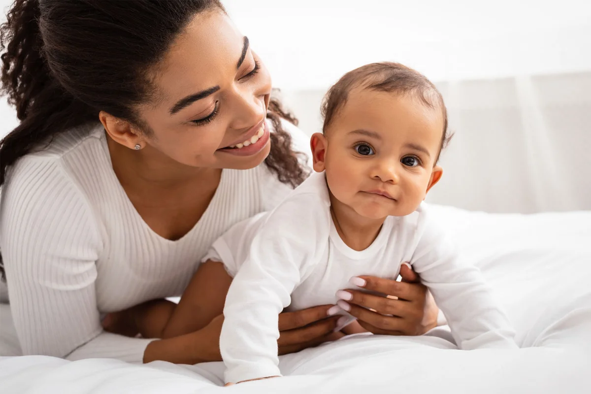 mother smiling at baby