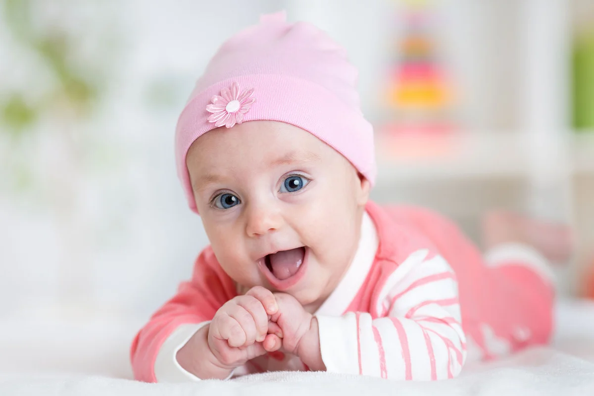baby girl in pink outfit