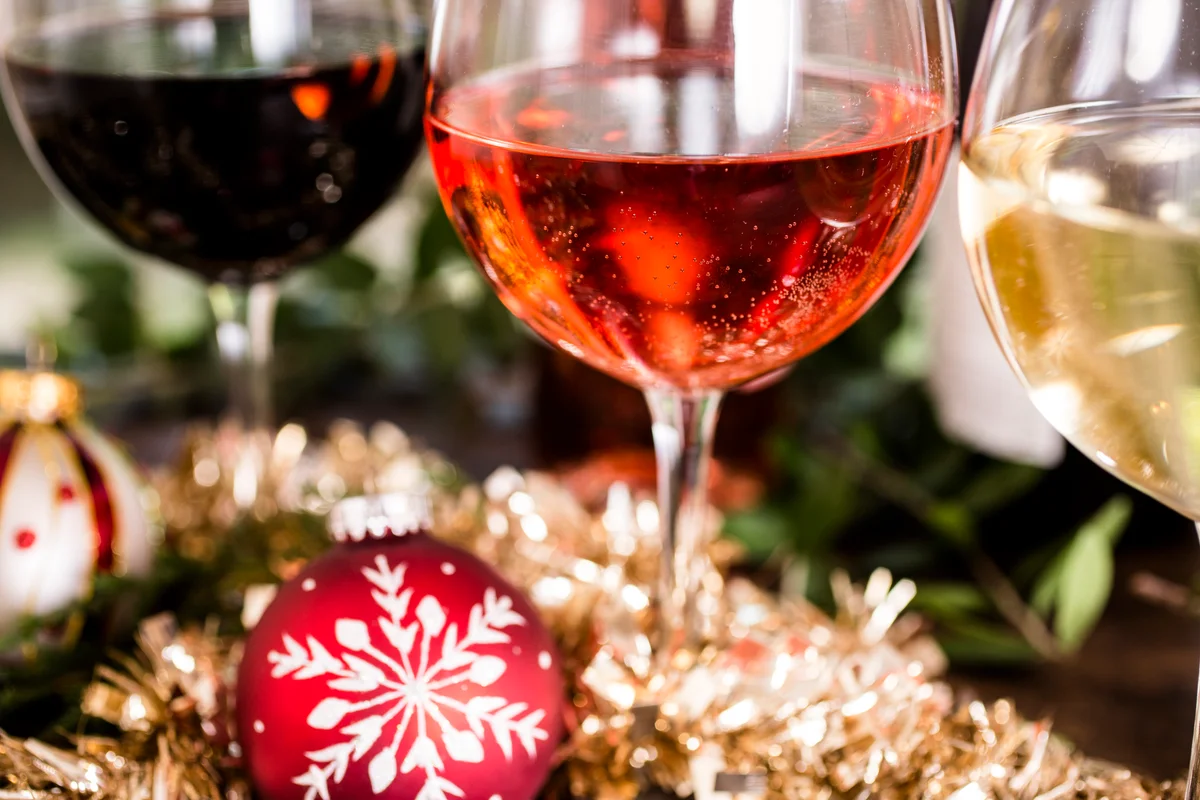 glasses of wine in a Christmas setting