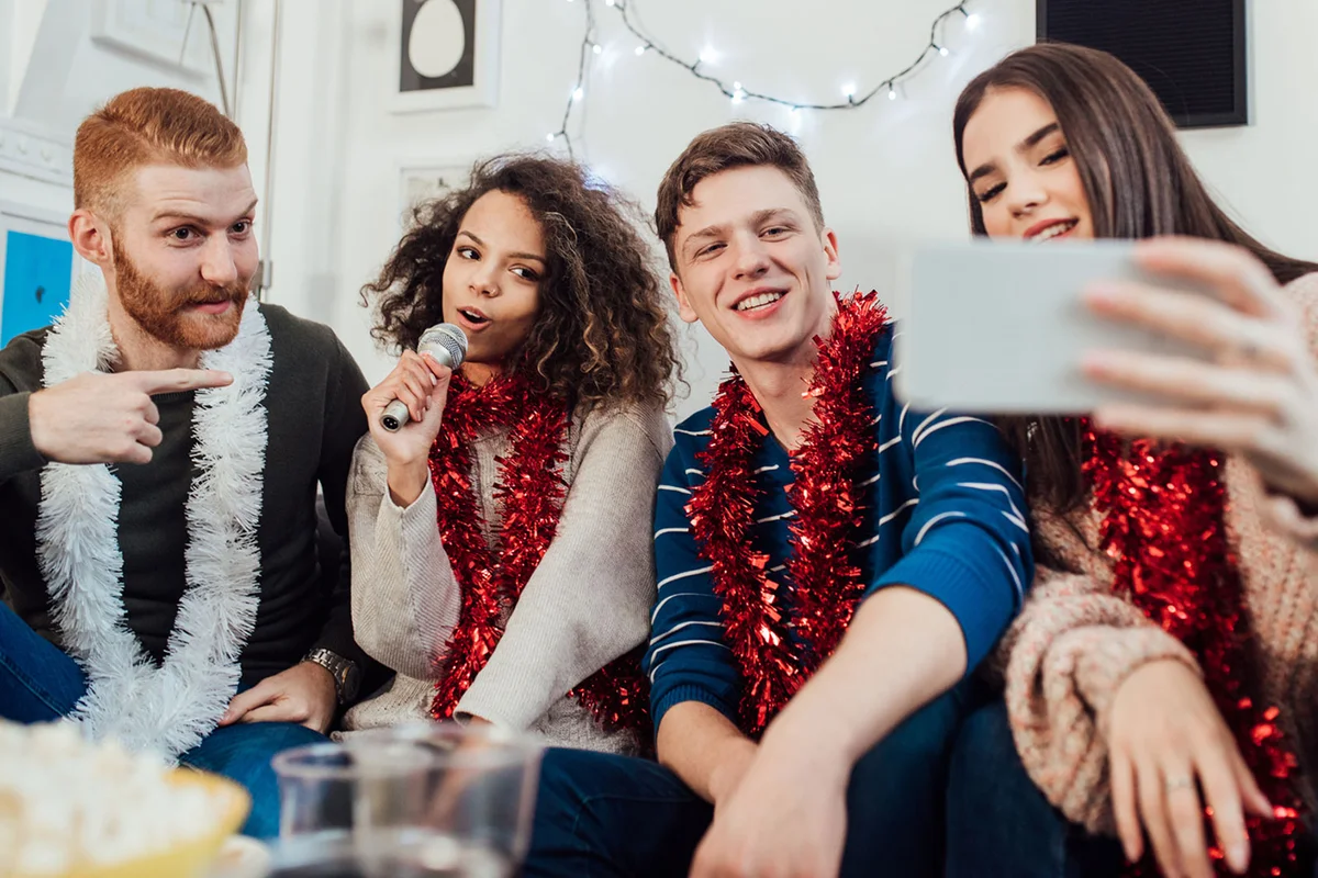 friends having a Christmas karaoke party