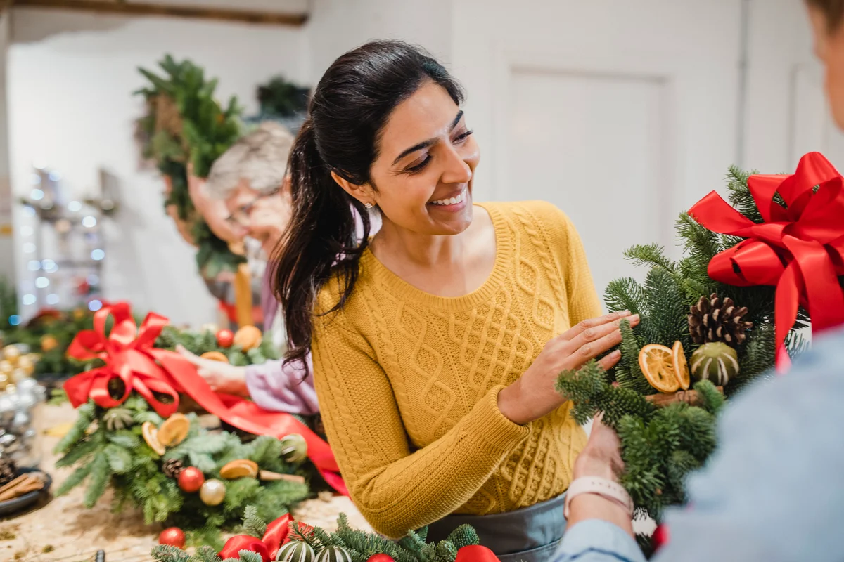 woman making Christmas wreath