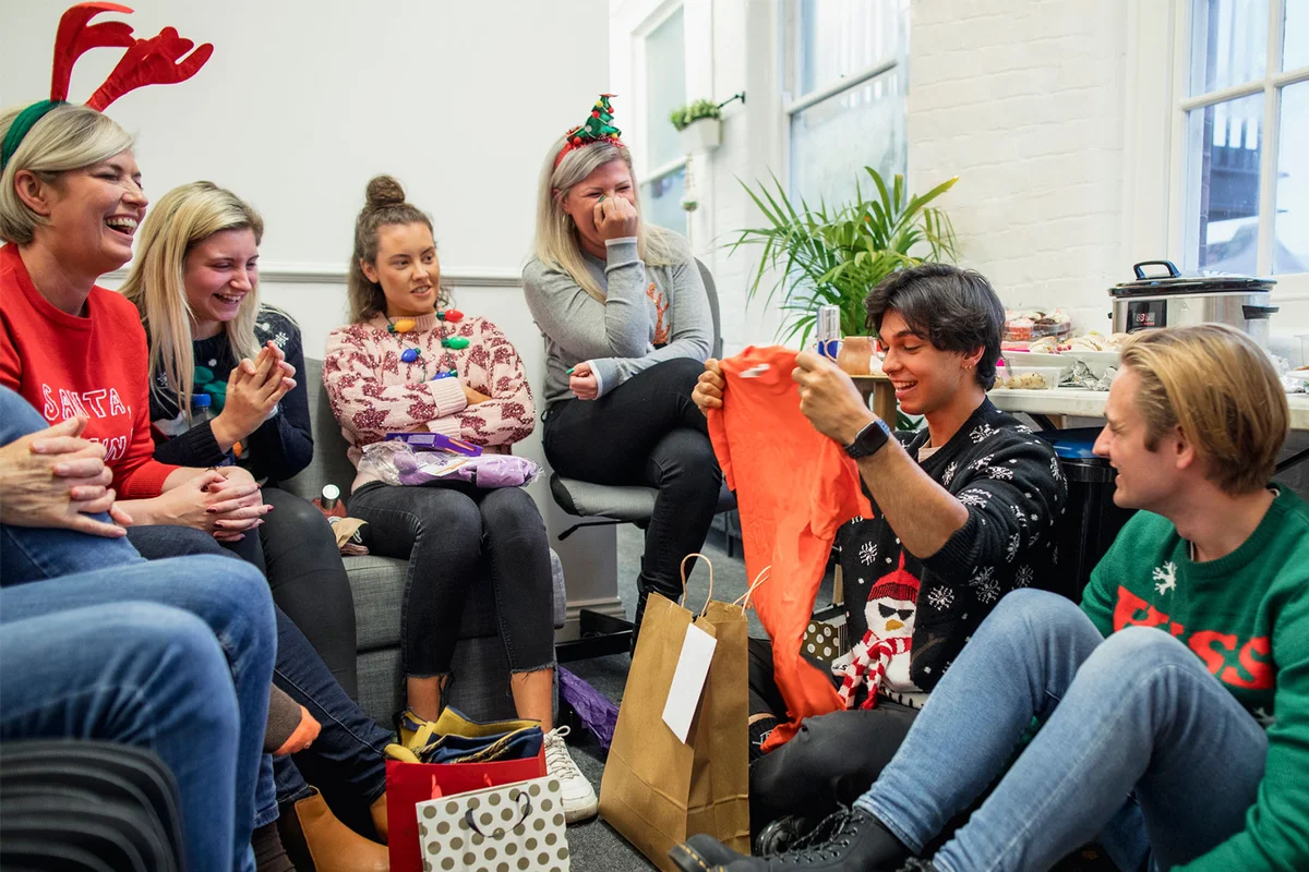 secret santa party exchanging gifts
