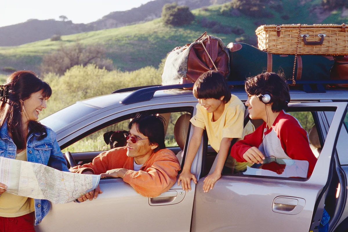 Family in Parked Car Looking at Map