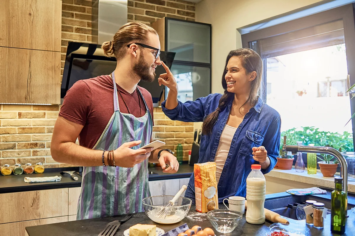 Couple having fun cooking together