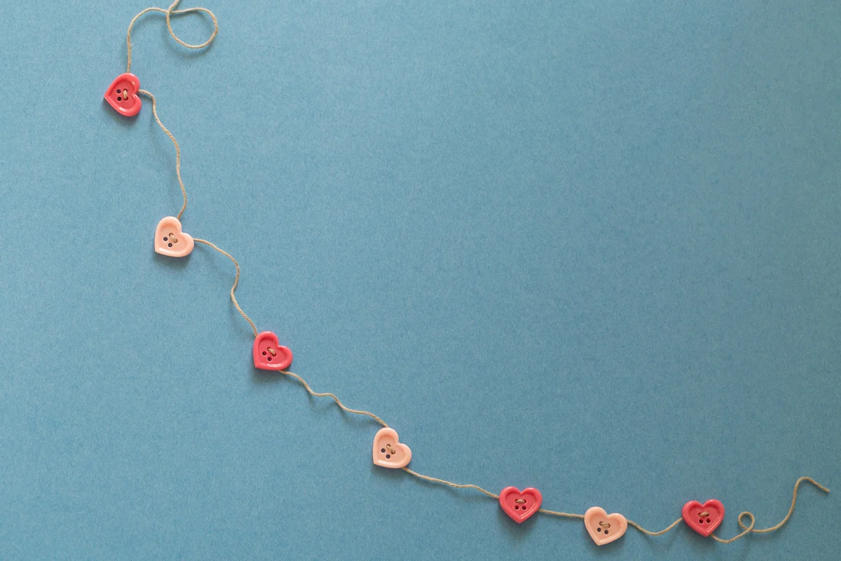 Twine swag with pink heart shaped buttons