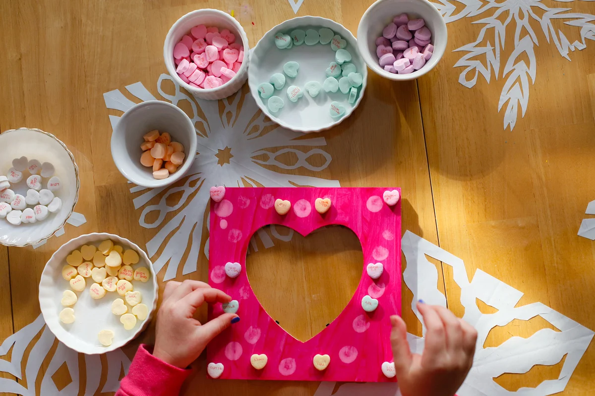 A Child Making a Picture Frame for Valentine's Day