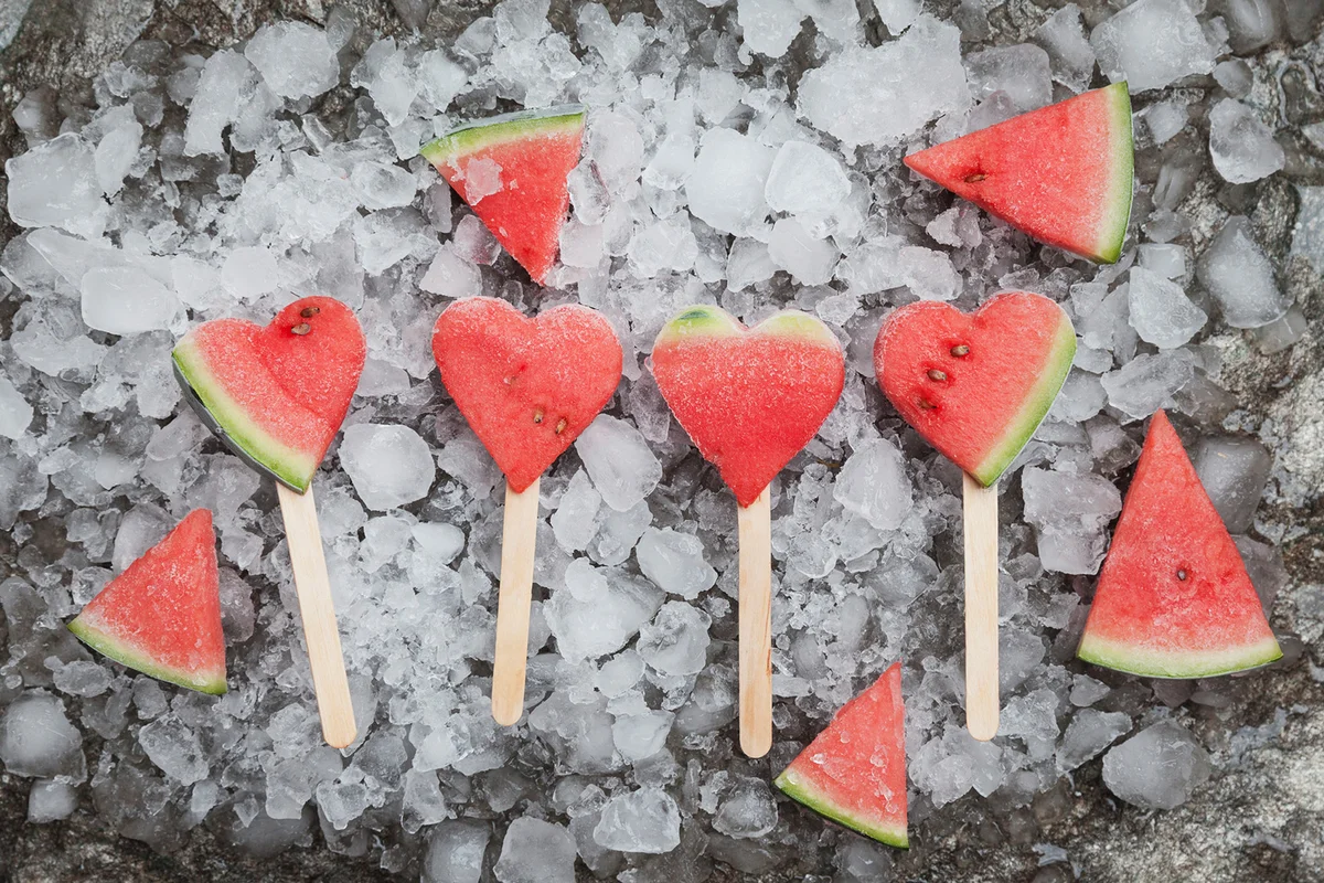 Watermelon heart lollies on crashed ice