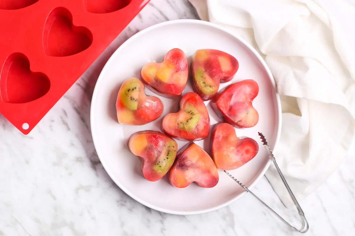 Homemade heart-shaped ice cubes on plate