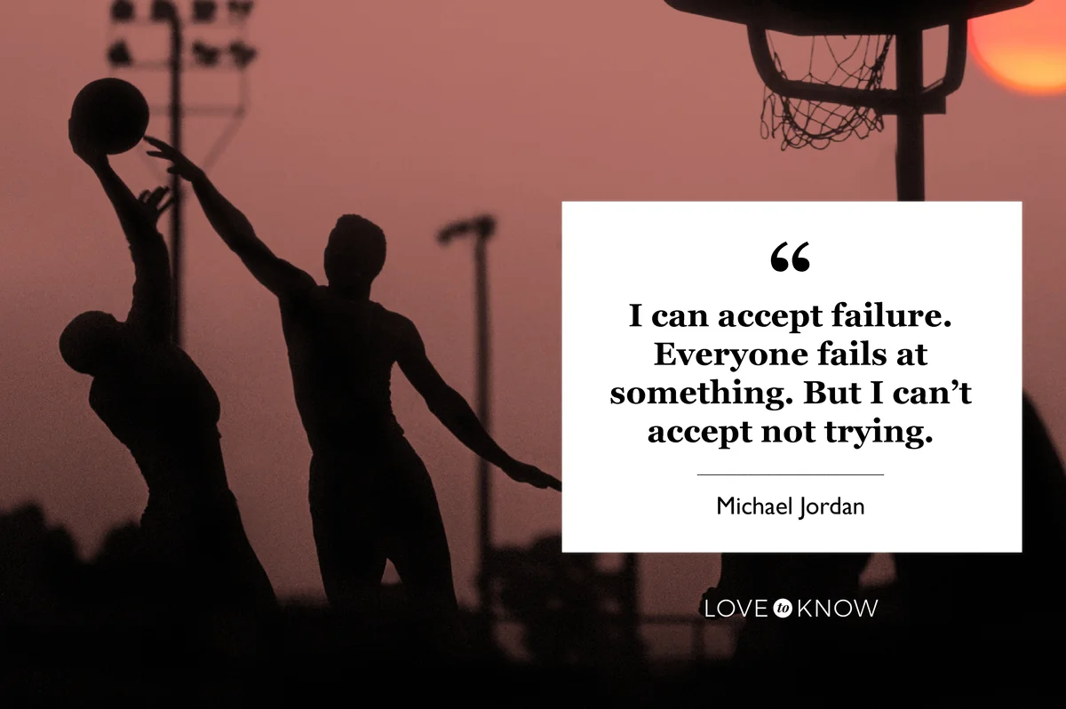 Young men playing basketball at sunset