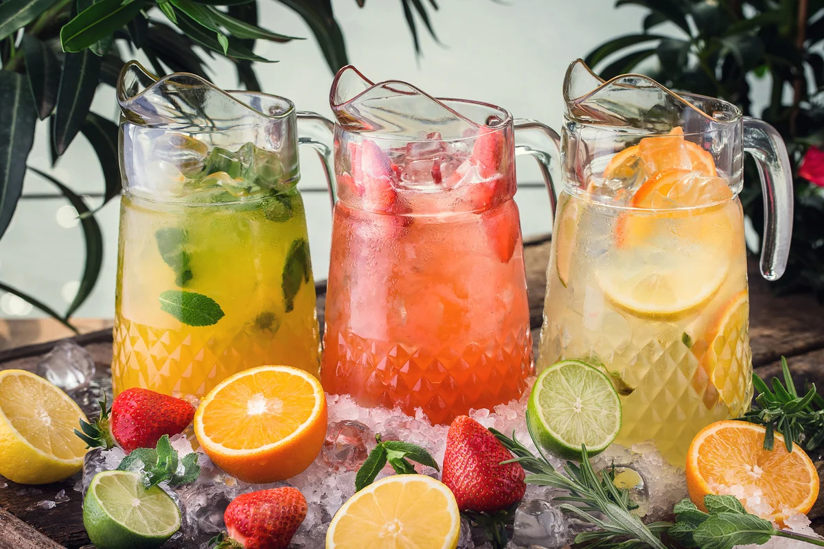 Three different jugs of wine and vodka punch