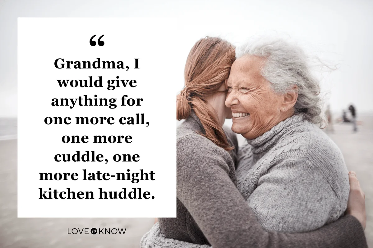Affectionate grandmother and granddaughter hugging on the beach