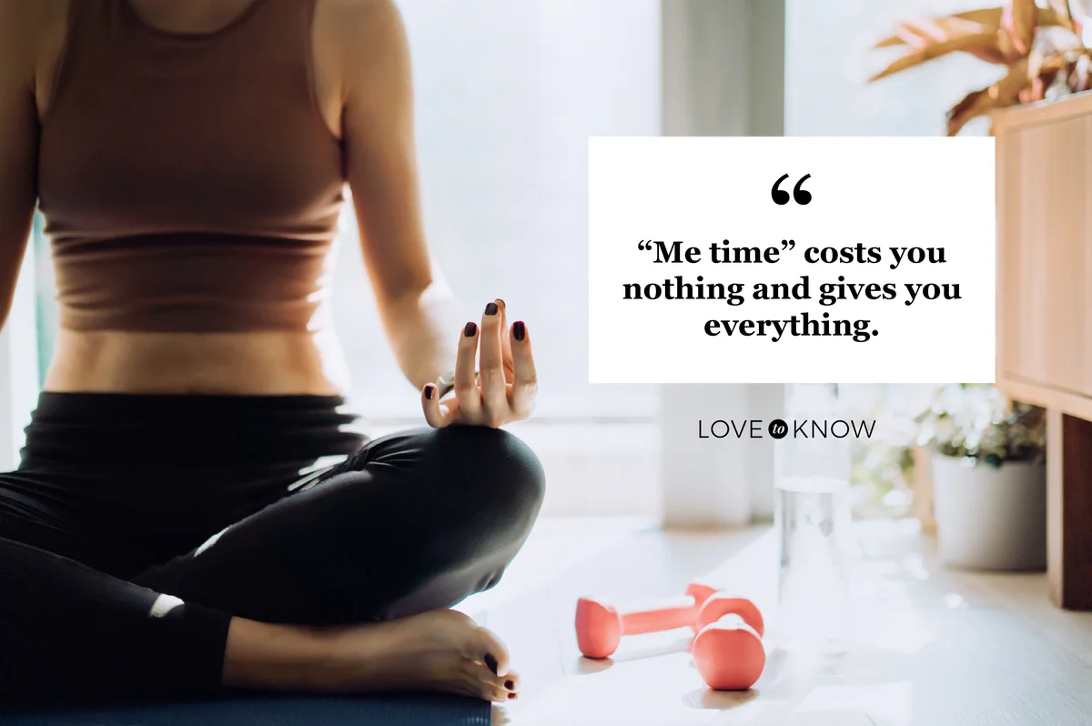 Woman sitting on the exercise mat, meditating in the lotus pose