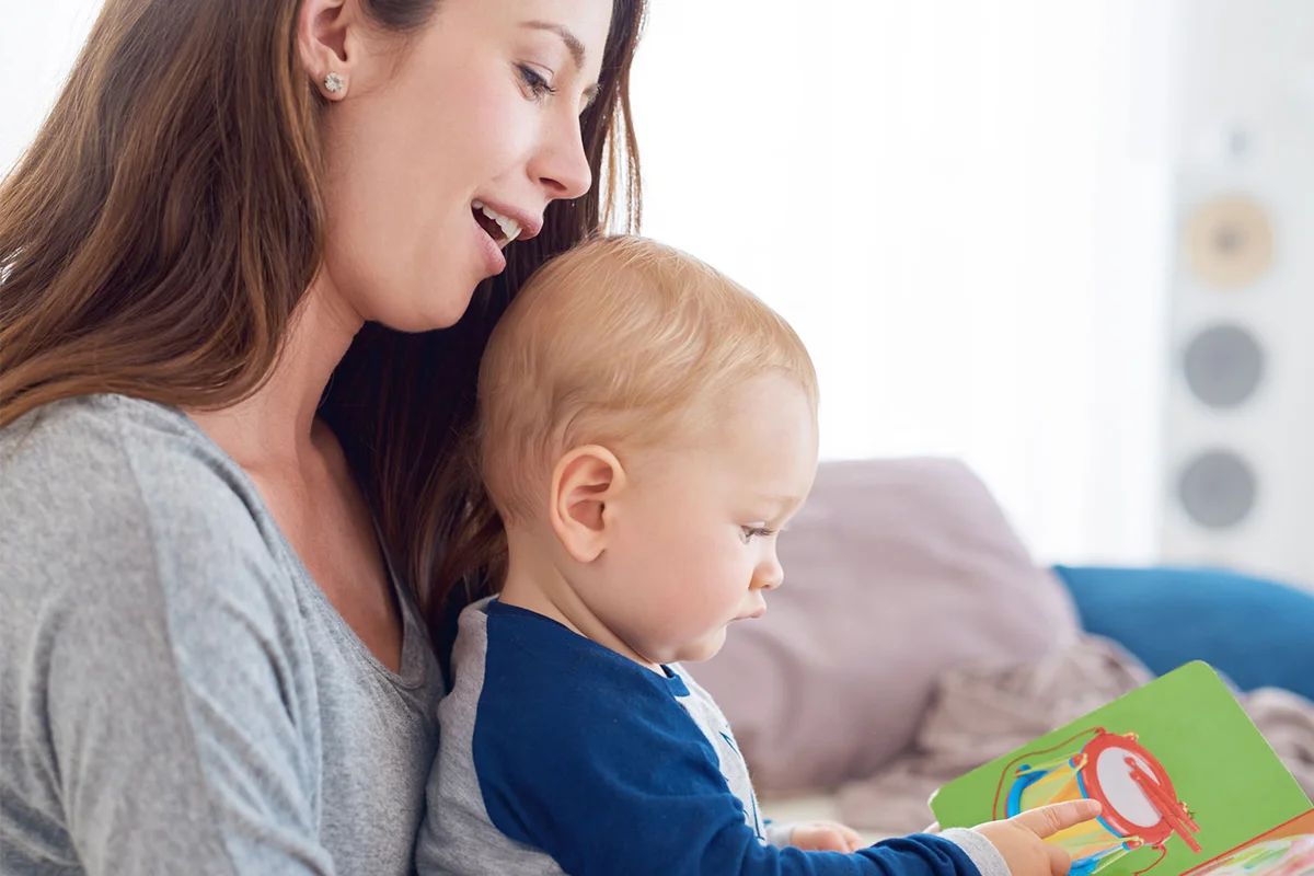 babysitter reading to baby