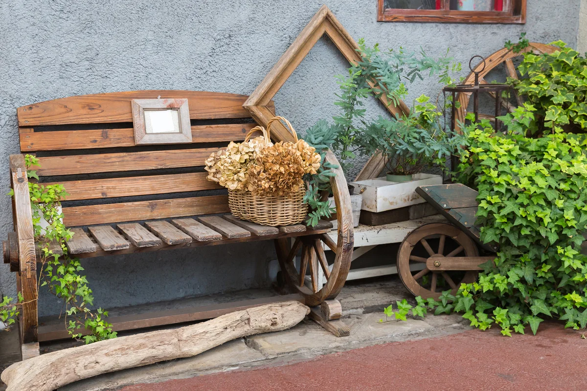 Decoration of faemhouse style with bench and Wicker basket in garden